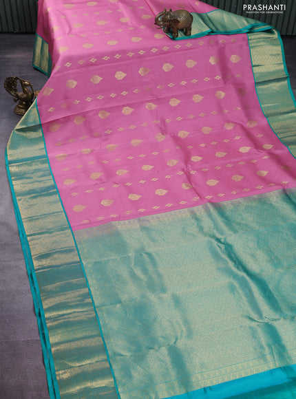 Pure kanchipuram silk saree peach pink and teal green shade with zari woven buttas and zari woven korvai buttas