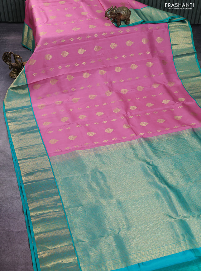 Pure kanchipuram silk saree peach pink and teal green shade with zari woven buttas and zari woven korvai buttas