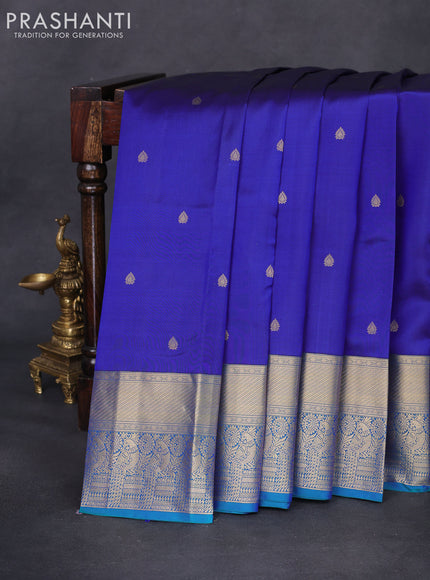 Pure kanchipuram silk saree blue and dual shade of green with zari woven buttas and rich zari woven border