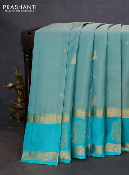 Pure kanchipuram silk saree pastel shade and teal blue with zari woven buttas and long zari woven butta border