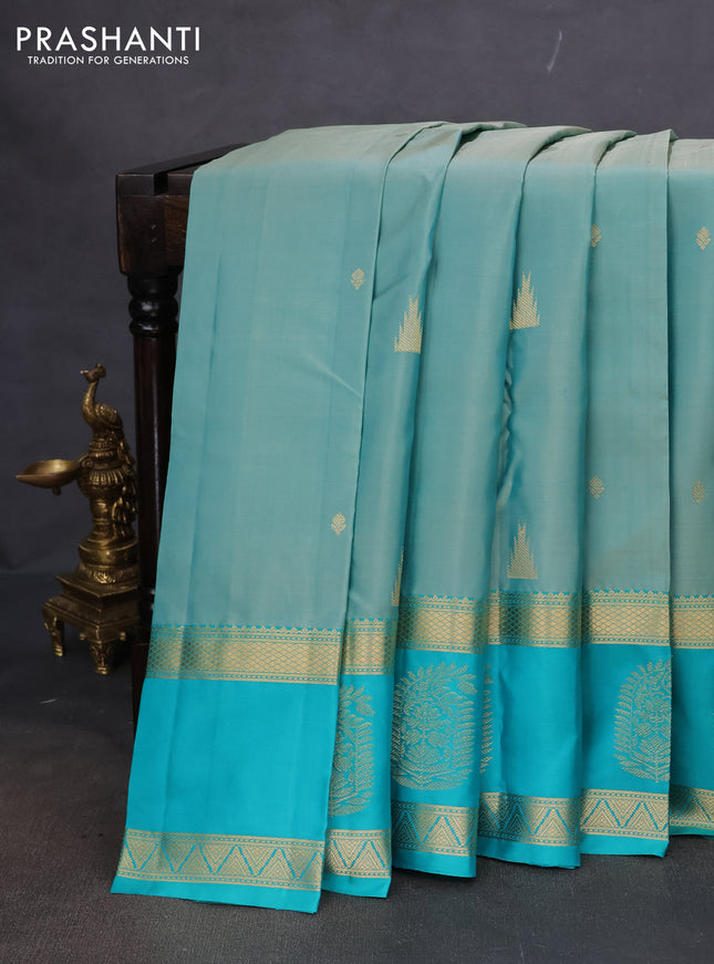 Pure kanchipuram silk saree pastel shade and teal blue with zari woven buttas and long zari woven butta border