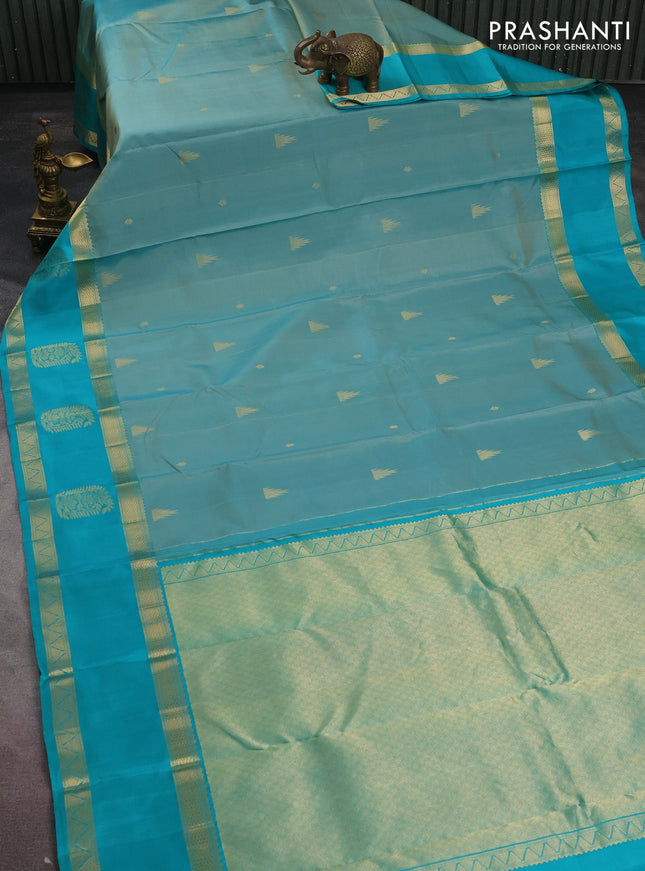 Pure kanchipuram silk saree pastel shade and teal blue with zari woven buttas and long zari woven butta border
