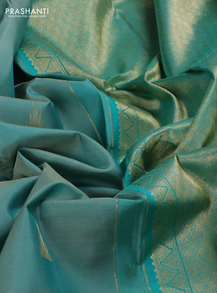 Pure kanchipuram silk saree pastel shade and teal blue with zari woven buttas and long zari woven butta border