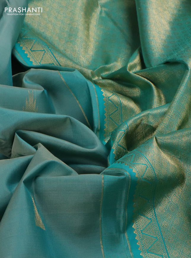 Pure kanchipuram silk saree pastel shade and teal blue with zari woven buttas and long zari woven butta border