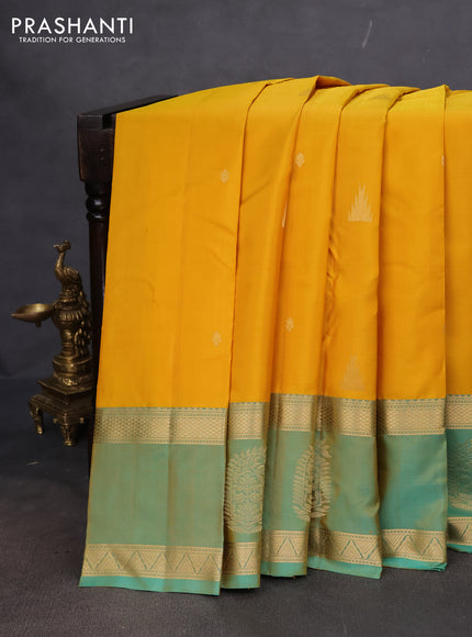 Pure kanchipuram silk saree yellow and dual shade of teal with zari woven buttas and long zari woven butta border