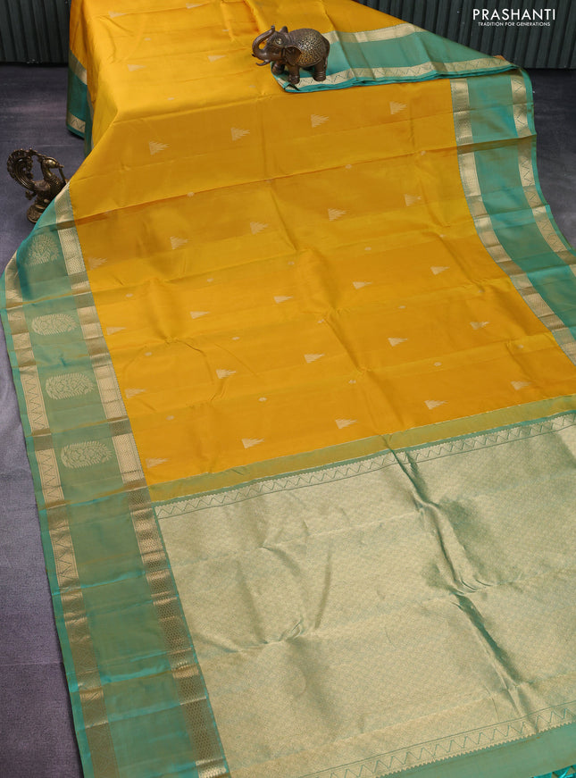 Pure kanchipuram silk saree yellow and dual shade of teal with zari woven buttas and long zari woven butta border