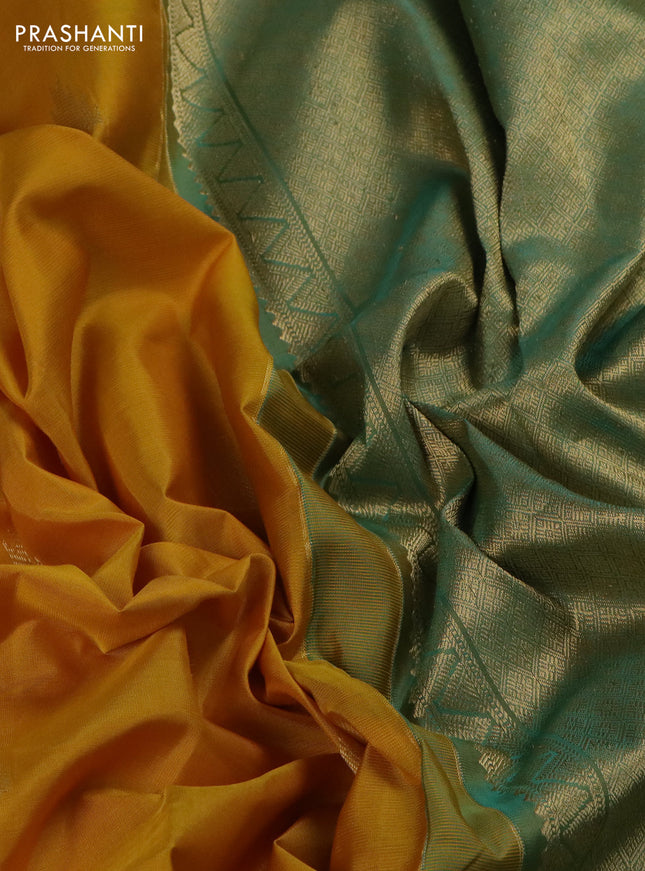 Pure kanchipuram silk saree yellow and dual shade of teal with zari woven buttas and long zari woven butta border