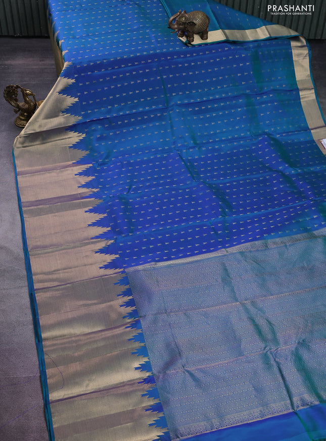 Pure kanchipuram silk saree dual shade of bluish green and pink with allover zari woven temple buttas and long temple zari woven border