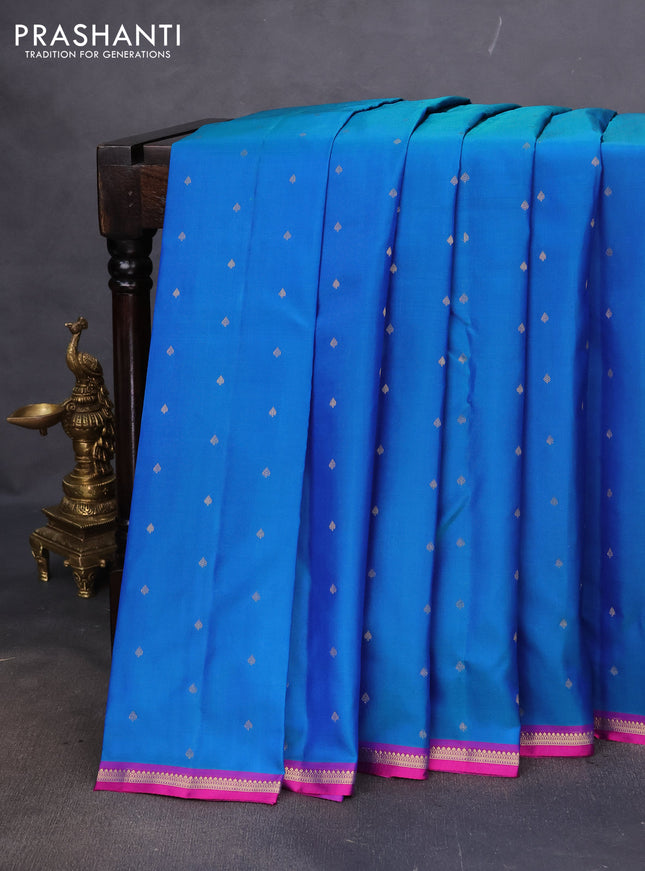 Pure kanchipuram silk saree dual shade of bluish green and purple with allover zari woven 1000 buttas and small zari woven border