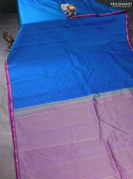 Pure kanchipuram silk saree dual shade of bluish green and purple with allover zari woven 1000 buttas and small zari woven border