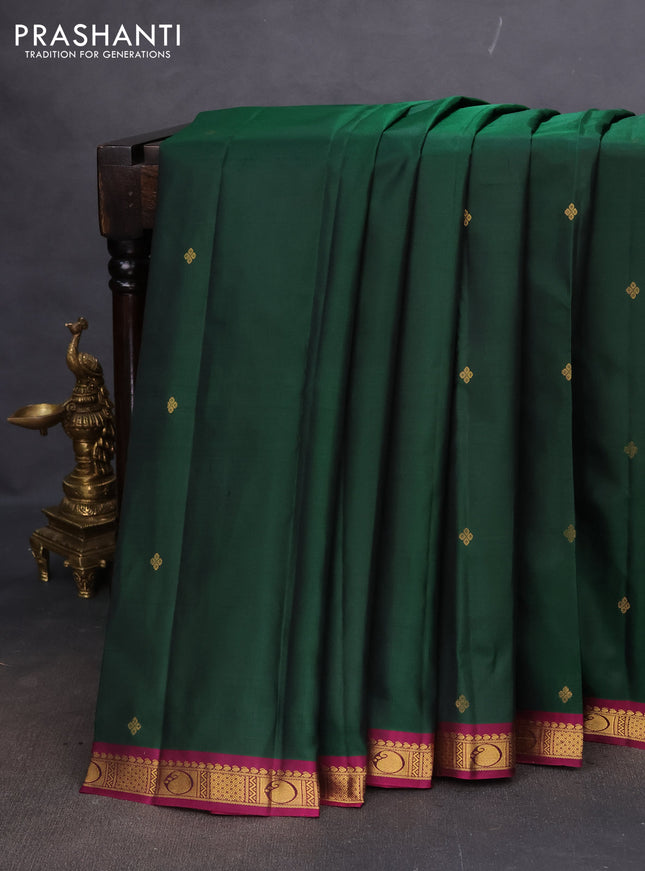 Pure kanchipuram silk saree bottle green and dark magenta pink with zari woven buttas and small zari woven border