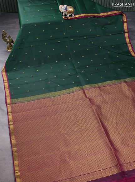 Pure kanchipuram silk saree bottle green and dark magenta pink with zari woven buttas and small zari woven border