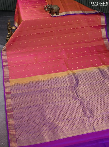 Pure kanchipuram silk saree dual shade of pinkish yellow and purple with allover zari woven buttas and zari woven border