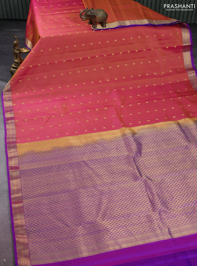 Pure kanchipuram silk saree dual shade of pinkish yellow and purple with allover zari woven buttas and zari woven border