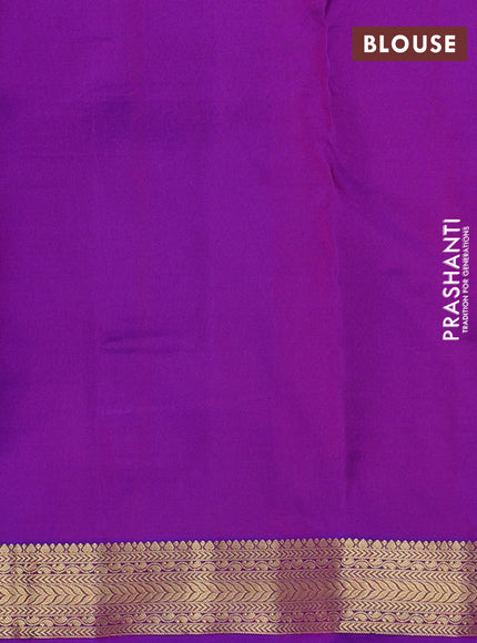 Pure kanchipuram silk saree dual shade of pinkish yellow and purple with allover zari woven buttas and zari woven border
