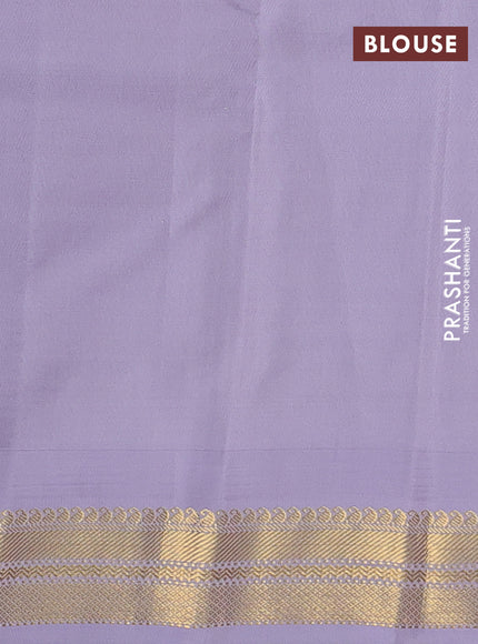 Pure kanchipuram silk saree green and pastel lavender with plain body and temple design zari woven korvai border