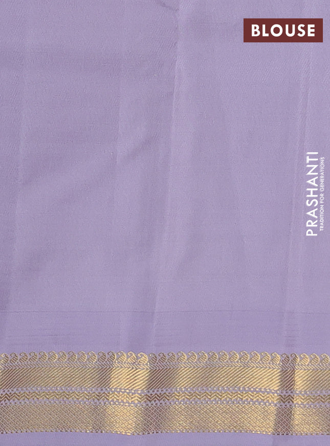 Pure kanchipuram silk saree green and pastel lavender with plain body and temple design zari woven korvai border