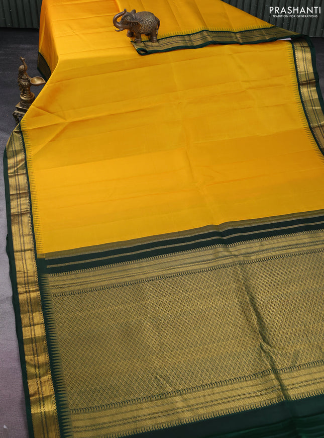 Pure kanchipuram silk saree yellow and bottle green with plain body and temple design zari woven korvai border