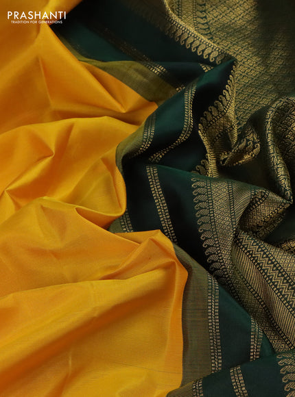 Pure kanchipuram silk saree yellow and bottle green with plain body and temple design zari woven korvai border