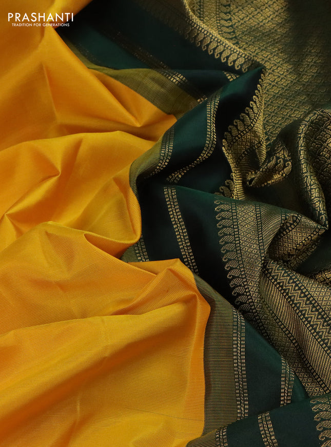 Pure kanchipuram silk saree yellow and bottle green with plain body and temple design zari woven korvai border