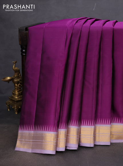 Pure kanchipuram silk saree purple and grey shade with plain body and temple design zari woven korvai border