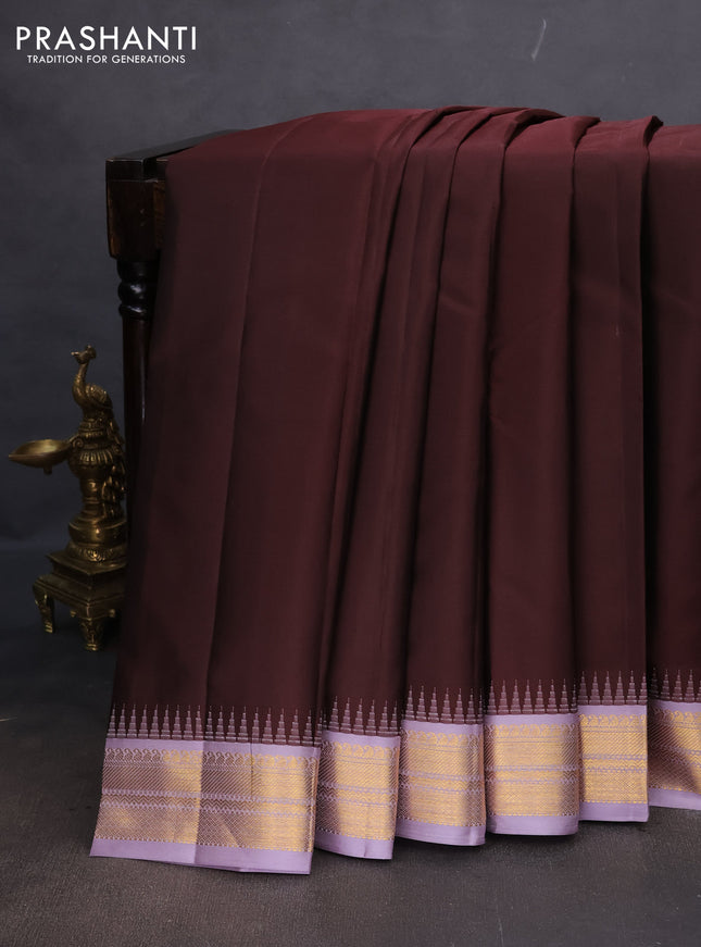 Pure kanchipuram silk saree coffee brown and pastel lavender with plain body and temple design zari woven korvai border