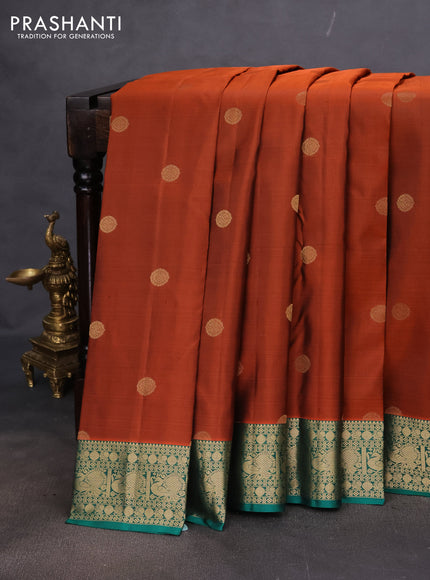 Pure kanchipuram silk saree rust shade and teal green with zari woven buttas and annam zari woven border