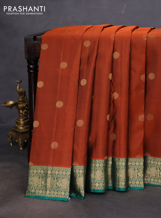 Pure kanchipuram silk saree rust shade and teal green with zari woven buttas and annam zari woven border