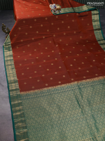 Pure kanchipuram silk saree rust shade and teal green with zari woven buttas and annam zari woven border