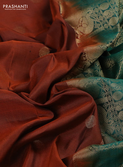 Pure kanchipuram silk saree rust shade and teal green with zari woven buttas and annam zari woven border