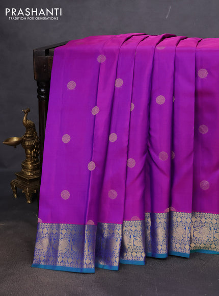Pure kanchipuram silk saree purple and dual shade of teal green with zari woven buttas and annam zari woven border