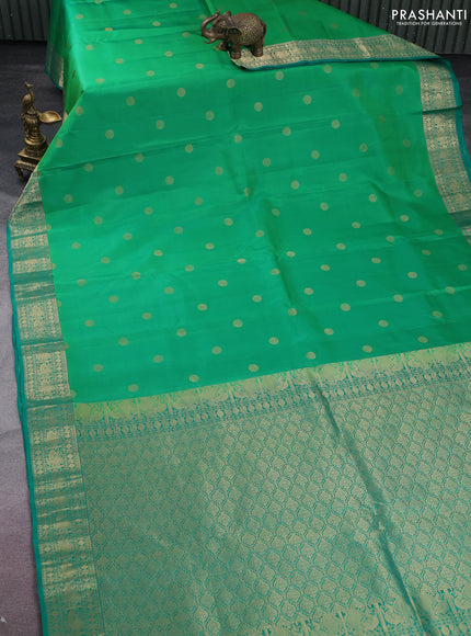 Pure kanchipuram silk saree green and teal green with zari woven buttas and annam zari woven border