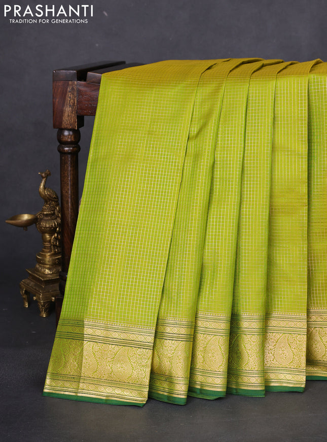 Pure kanchipuram silk saree light green and green with allover small zari checked pattern and zari woven border