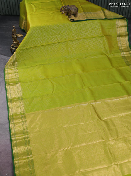 Pure kanchipuram silk saree light green and green with allover small zari checked pattern and zari woven border