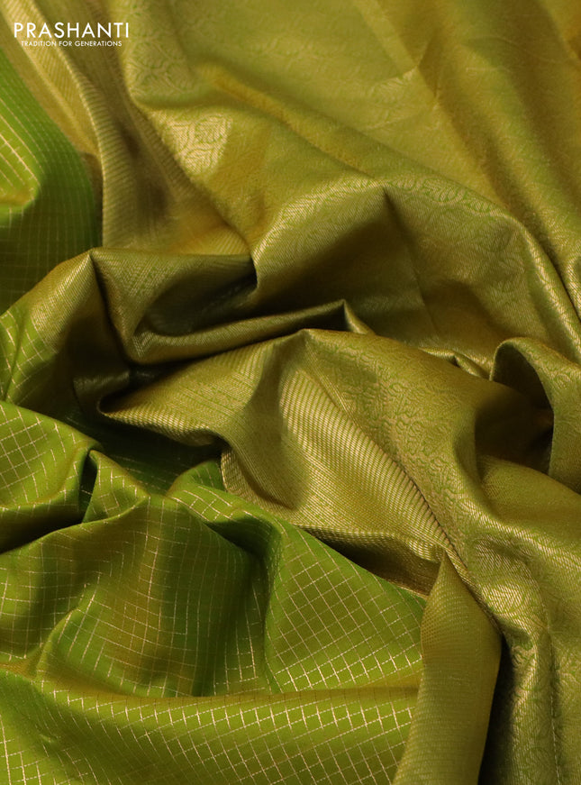 Pure kanchipuram silk saree light green and green with allover small zari checked pattern and zari woven border