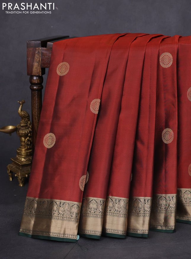 Pure kanchipuram silk saree rust shade and bottle green with zari woven buttas and zari woven border