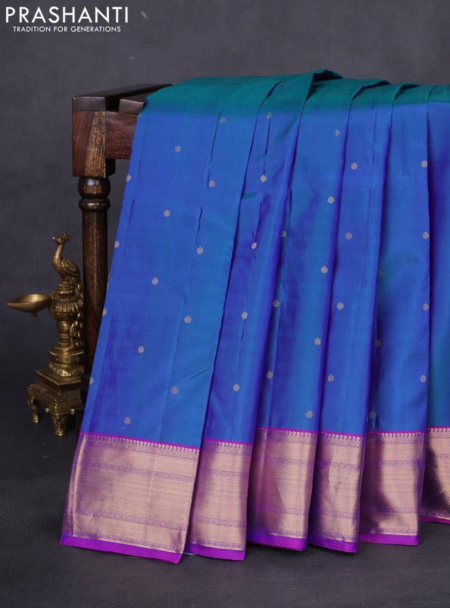 Pure kanchipuram silk saree dual shade of bluish green and purple with zari woven buttas and rich zari woven border