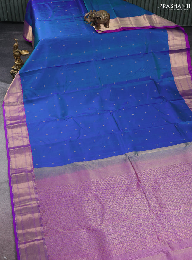 Pure kanchipuram silk saree dual shade of bluish green and purple with zari woven buttas and rich zari woven border