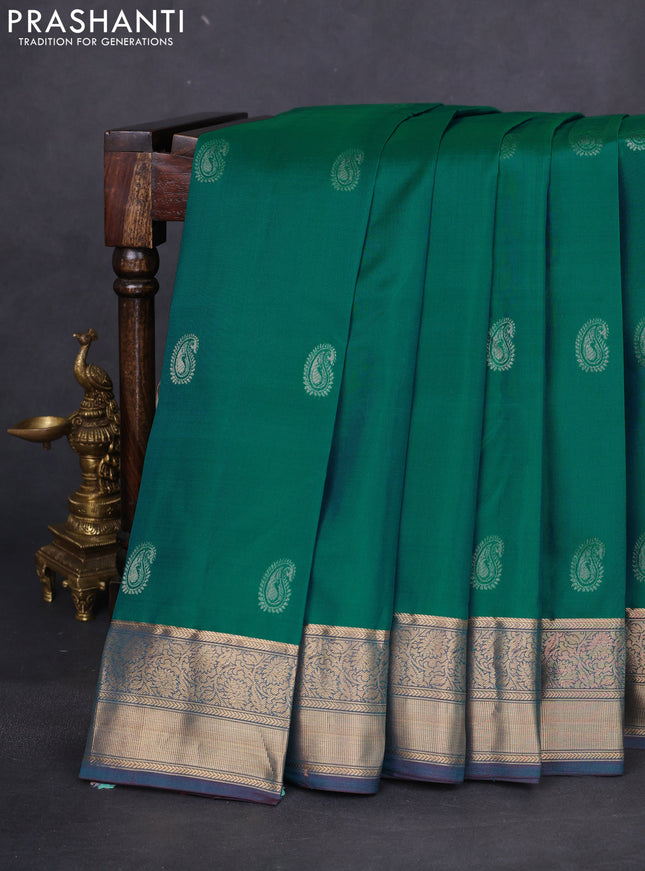 Pure kanchipuram silk saree teal green and dual shade of bluish maroon with paisley zari woven buttas and rich zari woven border