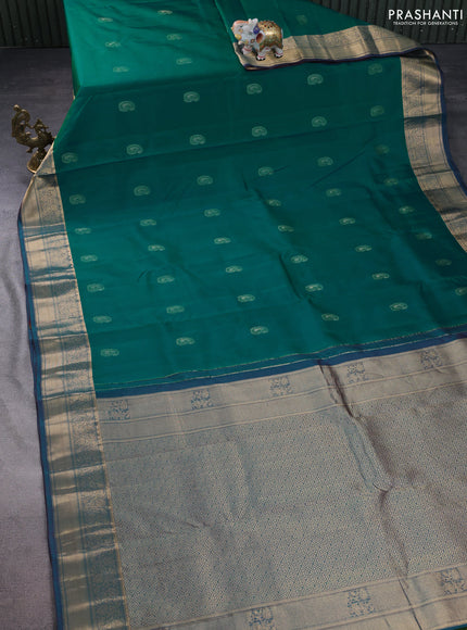 Pure kanchipuram silk saree teal green and dual shade of bluish maroon with paisley zari woven buttas and rich zari woven border