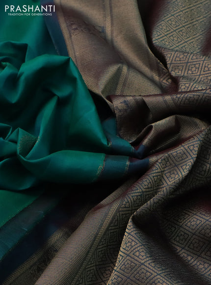 Pure kanchipuram silk saree teal green and dual shade of bluish maroon with paisley zari woven buttas and rich zari woven border