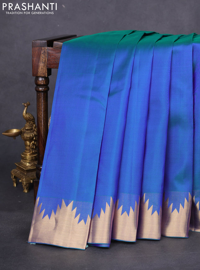 Pure kanchipuram silk saree dual shade of bluish green with plain body and temple zari woven border