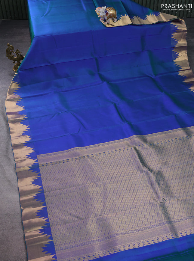 Pure kanchipuram silk saree dual shade of bluish green with plain body and temple zari woven border
