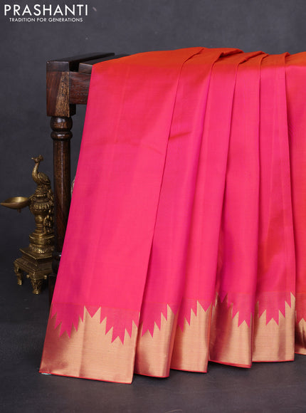 Pure kanchipuram silk saree dual shade of pinkish orange with plain body and temple zari woven border