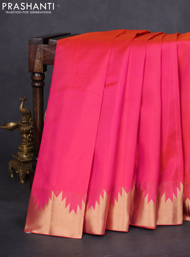 Pure kanchipuram silk saree dual shade of pinkish orange with plain body and temple zari woven border