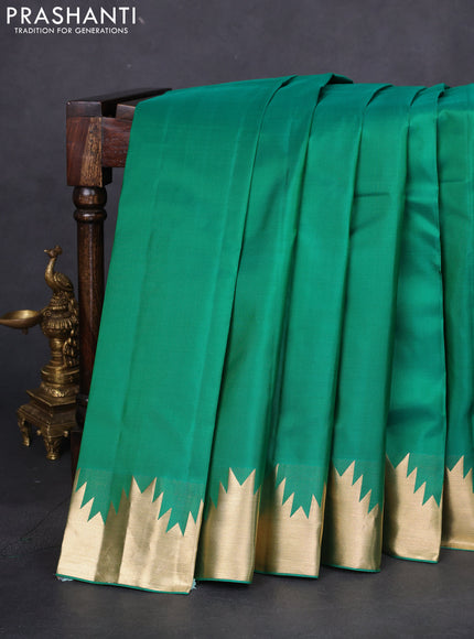 Pure kanchipuram silk saree green with plain body and temple zari woven border