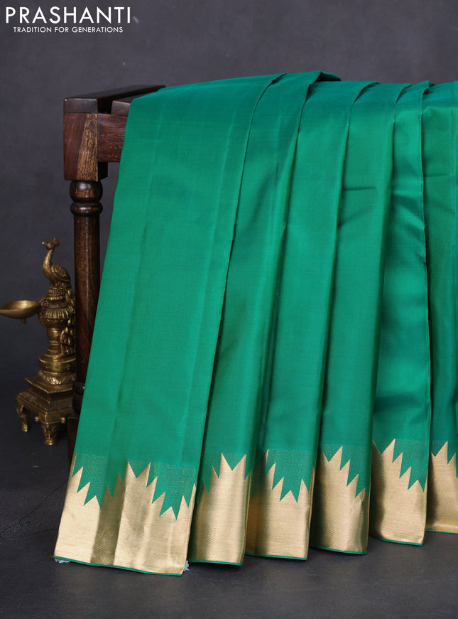 Pure kanchipuram silk saree green with plain body and temple zari woven border
