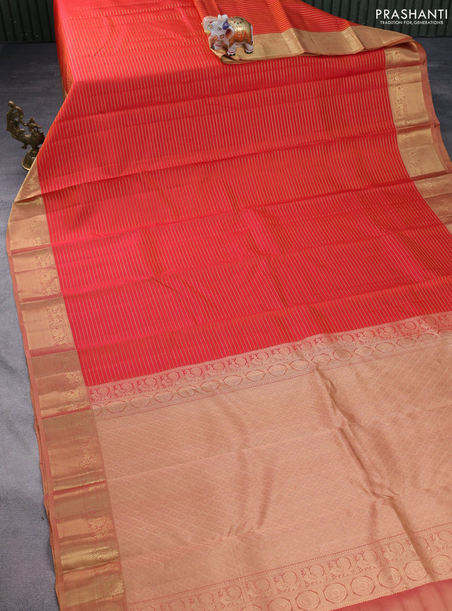 Pure kanchipuram silk saree dual shade of orange and dual shade of sandal with allover zari stripe pattern and rich zari woven border