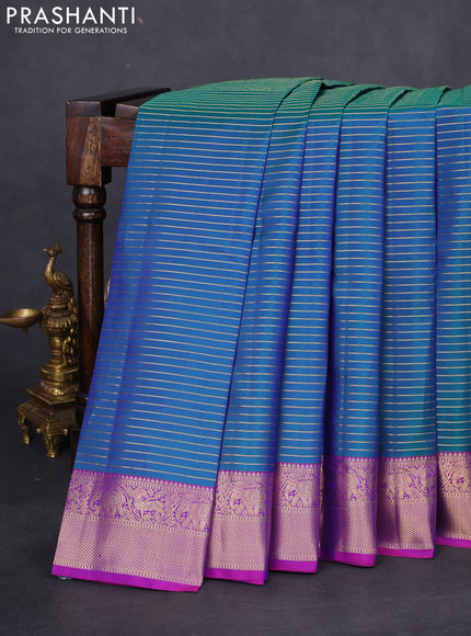 Pure kanchipuram silk saree dual shade of bluish green and purple with allover zari stripe weaves and rich zari woven border