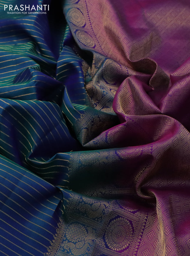 Pure kanchipuram silk saree dual shade of bluish green and purple with allover zari stripe weaves and rich zari woven border